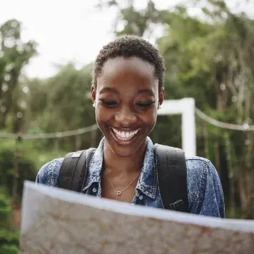 Person reading a map while traveling 
